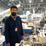 At the Smithsonian Institution’s Steven F. Udvar-Hazy Center, Daniel Ravizza stands in a hangar full of objects that shaped aviation history. The center is the annex of the National Air and Space Museum.
