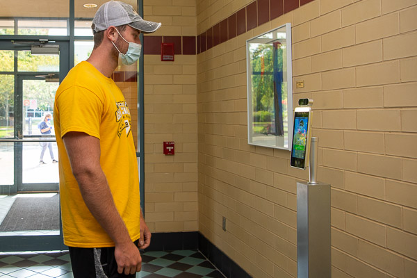 Getting lined up for his temperature check is freshman Ryan P. Eash, of Hooversville. A first-year student in heating, ventilation and air conditioning technology, Eash is about to become well-versed in the importance of an optimal thermal readout.