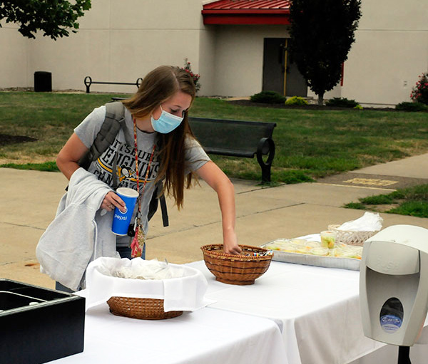Resident Assistant Danielle E. Malesky, a construction management major from Biglerville, snags a snack on the campus mall.