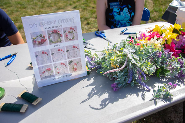 ... while, in another souvenir activity, attendees were encouraged to weave floral crowns.