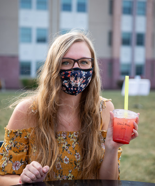Decked from top to mask in floral prints, KyLeigh L. Alexander, a pre-dental hygiene student from Portage, shows off her strawberry bubble tea.