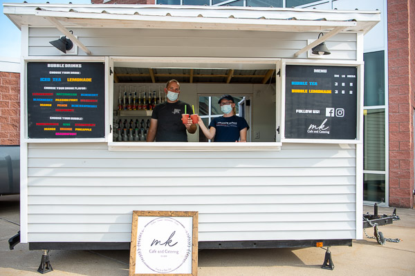 The Kenyons take a refreshing pause. Both sported Penn College gear, including Melyce’s Tomorrow Makers Program T-shirt and Penn College Alumni hat. 