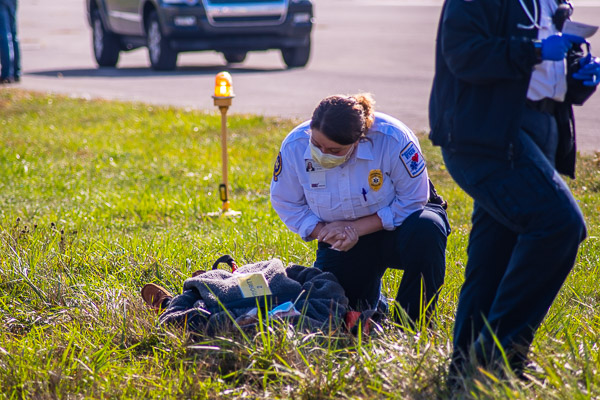 College alumna and UPMC paramedic Alyssa M. Ogden, who graduated in August 2019 with an associate degree in emergency medical services, assesses a 