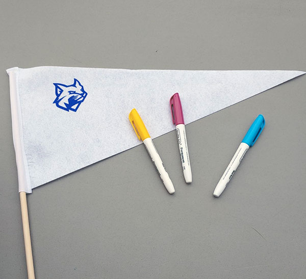 Markers and a wide-open canvas beckon those wishing to put their imprint on a Penn College pennant.