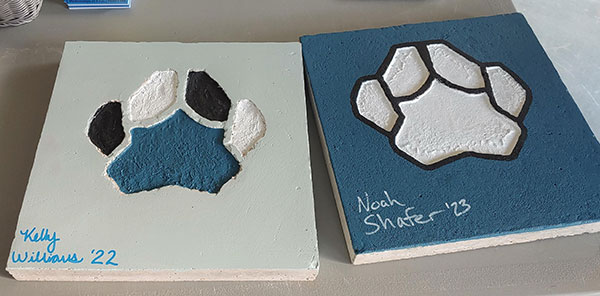 WEB's Wildcat Wednesday event emphasizes the roll-up-your-sleeves hallmark of a Penn College education – in this case, mascot pawprints, courtesy of the ConCreate Design Club.