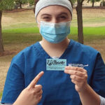 Lacey Decker, a dental hygiene student from Emporium, displays one of the cards distributed to students "caught" doing their part to keep Penn College hands-on. (Photo by Trisha M. Temple, coordinator of student engagement)