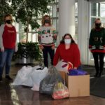 Gathering bags and boxes of cold-weather apparel for delivery Tuesday are (from left) Sue A. Mahaffey, coordinator of enrollment management operations; Barbara J. Stevens, secretary to college transitions and first-year initiatives; Joette M. Siertle, academic skills specialist: early alert tech and data systems; and Kelly S. Watkins, financial aid specialist, federal programs.