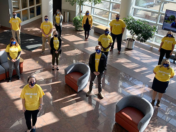 Admissions counselors Maddie L. Metzger and Bryce W. Winder gathered uniformly clad co-workers outside their Student & Administrative Services Center workspace, providing this safely distanced photo of advocacy for a vital cause.