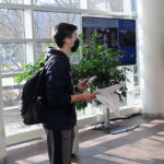 Framed by two of the columns depicted on the drawings in his hand, civil engineering technology major Brandon J. Sensenich, of Lancaster, follows along via a Microsoft Teams hookup.