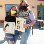 Depictions of Chinese-American movie star Anna May Wong and Mexican painter Frida Kahlo are held by Theta Phi Alpha sister Juliana N. Lucero (left), an applied health studies: occupational therapy assistant concentration major from Upper Darby, and WIC member Christine A. Limbert, a building science and sustainable design student from Curwensville.