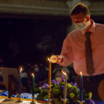 Tanner J. Layne lights his candle and prepares to recite, “I pledge myself to uphold the purposes of Alpha Chi, striving to make its ideals my ideals in scholarship and in service.”