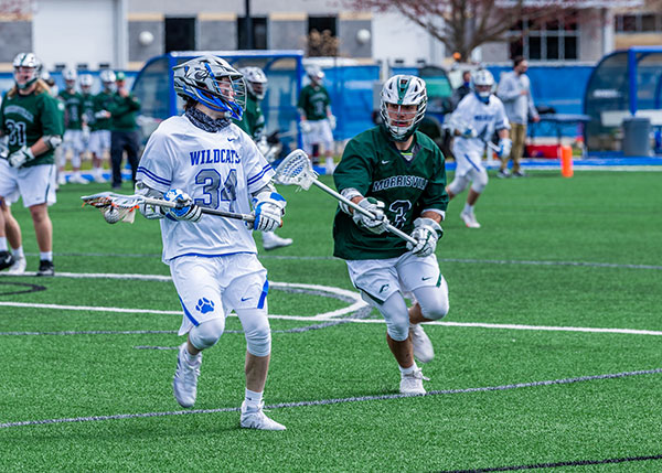 Quinn Caviola (34), shown here during the April 3 season opener against SUNY Morrisville, scored four goals in Sunday's match against La Roche University.