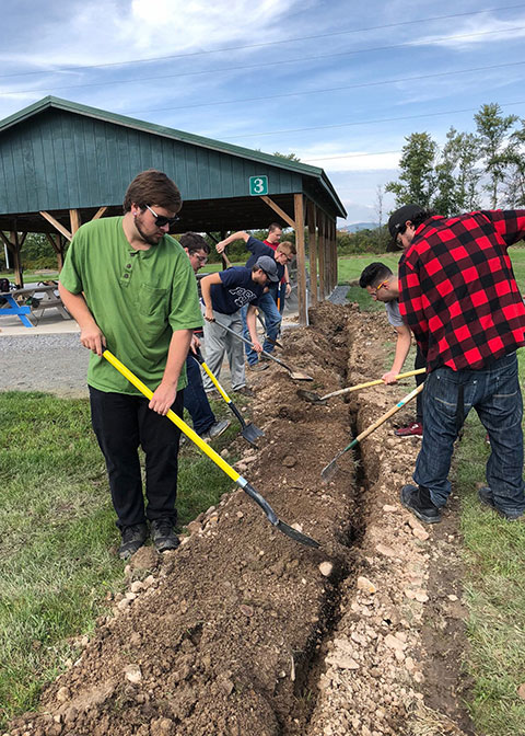 Previous projects undertaken by Penn College electrical construction students for area nonprofits – like the one shown here from October 2018 – include installing more than 2,000 feet of conduit as part of delivering electrical service to the Lime Bluff Recreation Area in Hughesville.