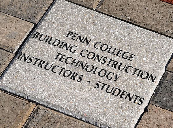 The keystone of the Penn College pathway, centered over the honorees' names below