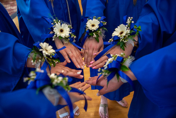 Early childhood education graduates received beautiful corsages from their instructor, Jillian T. Scanlon. 