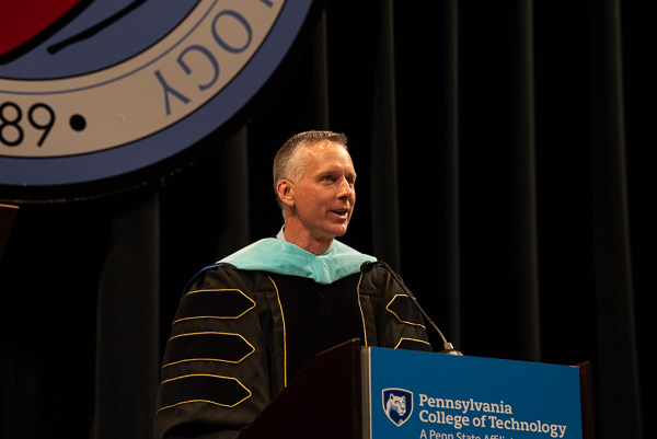 Michael J. Reed, vice president for academic affairs/provost, reassures graduates that the absence of on-stage faculty (many of whom watched virtually) in no way diminishes the institutional pride in their achievement: 