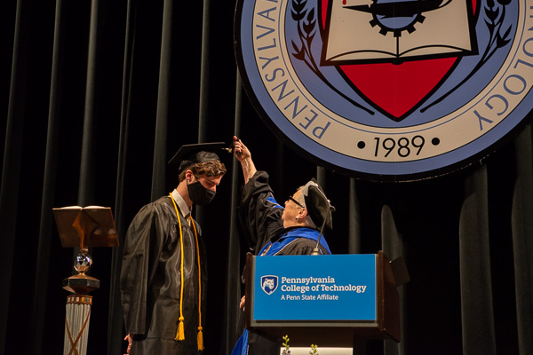 Gilmour turns McKenzie's tassel, as the 2020-21 Student Government Association president turns the page on his boundless future.