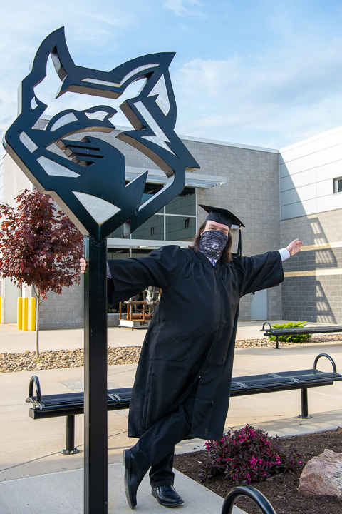 The brand-new holder of a degree in information assurance and cyber security, Thomas M. Herr, of Hummelstown, exults near the welded Wildcat north of College Avenue Labs – just one of the picture-perfect backdrops shared with commencement families.