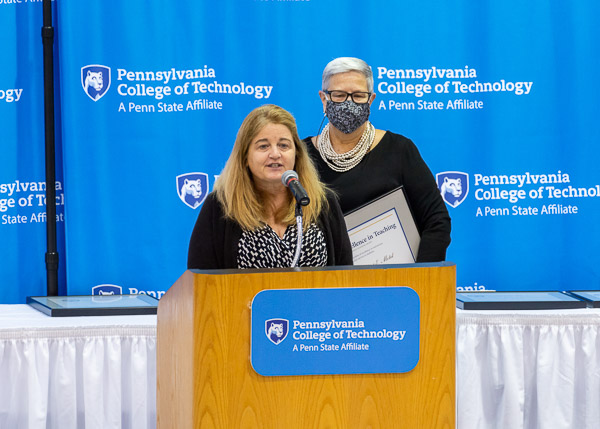 Excellence in Teaching honors were presented to Motel, who joined the faculty two years ago after leaving her full-time position as a dental hygienist. 