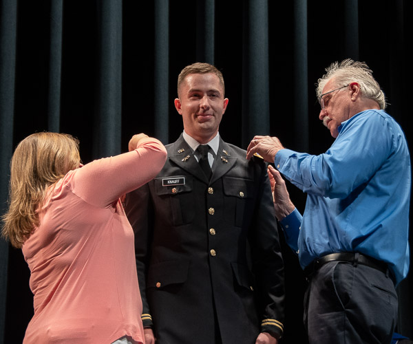 Brandon J. Knauff, who received a bachelor’s degree in manufacturing engineering technology, an associate degree in automated manufacturing and his commission as an active duty officer in the U.S. Army Chemical Corps, has his bars pinned to his shoulders by his parents.