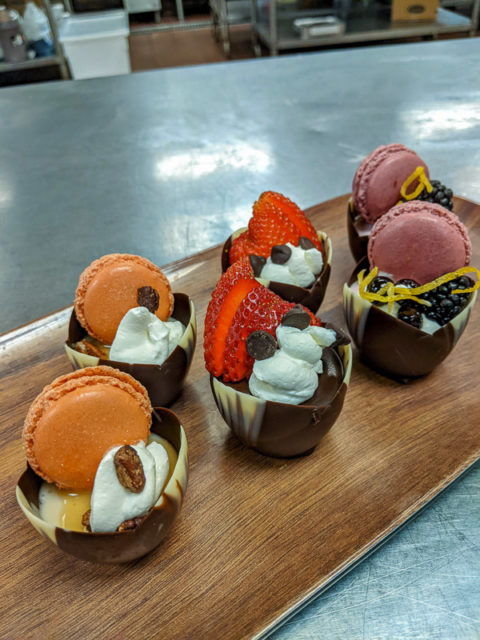In addition to high-volume food preparation, the students created 60 eye-catching desserts for a “very VIP tent.”