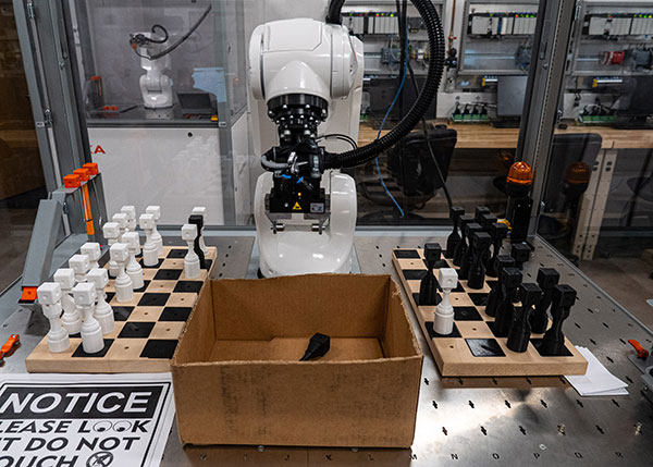 McGinley employed this Kuka industrial robot to add some “pizazz” to his senior project for the automation engineering technology: robotics and automation major. McGinley linked the robot to a virtual chess game he created. The robot moves plastic pieces on wooden chessboards to correspond to the on-screen activity.