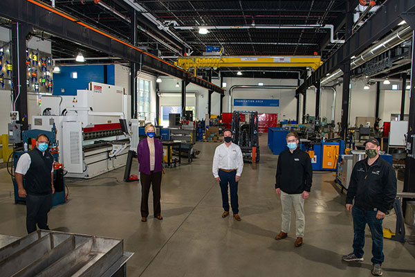 Visiting the welding facilities at Pennsylvania College of Technology are (from left): Robert Delcoco Jr., Philadelphia district manager, Lincoln Electric; Elizabeth A. Biddle, director of corporate relations, Penn College; Sean P. Moran, lead welding engineer, Philly Shipyard Inc.; Christopher Tkatch, technical sales representative, Lincoln Electric; and James N. Colton II, assistant professor/co-department head of welding, Penn College.