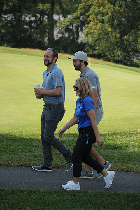 Kyle A. Smith, executive director of college relations and the Penn College Foundation, and Loni N. Kline, vice president for college relations, enjoy Jeremy Poincenot's humor upon welcoming him to the Williamsport Country Club.