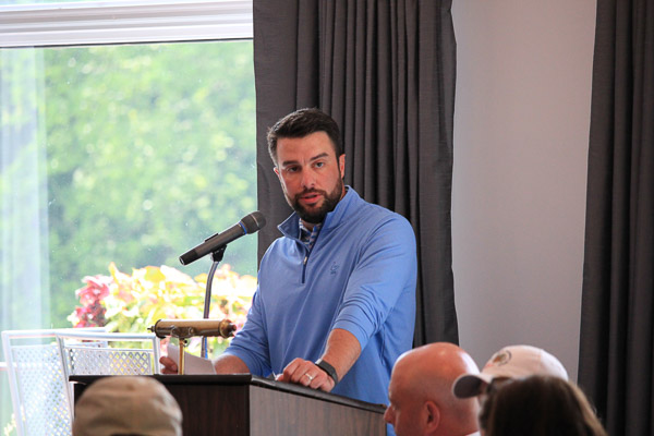Allen W. Kiessling, a member of the Penn College Foundation Board of Directors and the Golf Classic Committee, welcomes players to lunch.