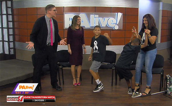 "Big" little brother Christopher (center) leads an impromptu dance party on the set of "PA live!