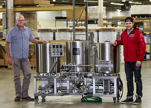 George “Herman” Logue Jr., left, and George Logue III have donated a professional-grade brewing system to Pennsylvania College of Technology for instructional use in the college’s brewing & fermentation science certificate major.