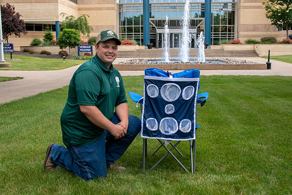 Penn College student Trey L. White developed the Chillin’ Chair Challenge, a compact, lightweight tossing game that attaches to the back of a chair. White, who is pursuing an innovation leadership competency credential, along with a bachelor’s degree in applied technology studies, conceived the product in in February; it is already available for purchase.