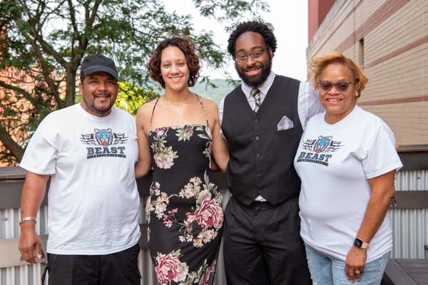 Alumni honoree Thompson gathers with his parents and fiancée, honoring his esports/gaming outreach and invoking the motivating "B.E.A.S.T." within us all.