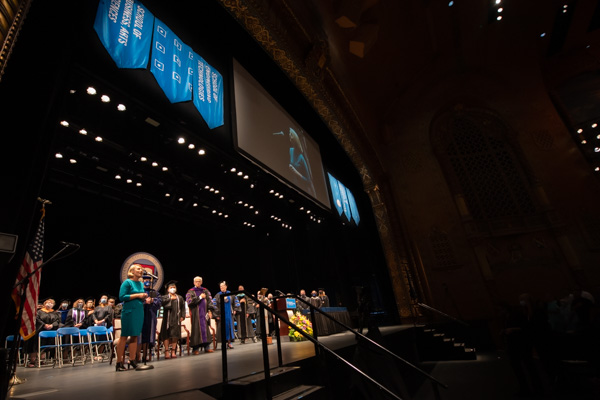 After a splendid debut during the closing commencement ceremony in May, Loni N. Kline returns to the stage to sing "The Star-Spangled Banner." Kline is vice president for college relations.