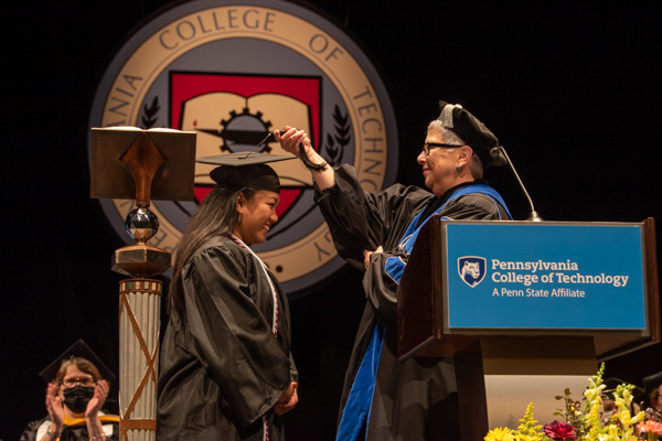 Turning the tassel of the class representative, who added a PA degree to an impressive roster of achievements: a doctorate, an earlier bachelor's degree and military service, among them