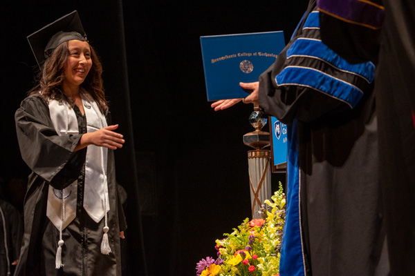 Physician assistant graduate Maepearl E. St. George, of Pleasant Gap, puts a distinguished cap on her Penn College years (which included service as a Presidential Student Ambassador and Community Peer Educator).