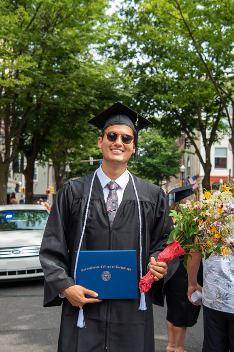 Mikhail S.P. Bahr, of Williamsport, among the day's physician assistant grads, radiates coolness on a sweltering August day.