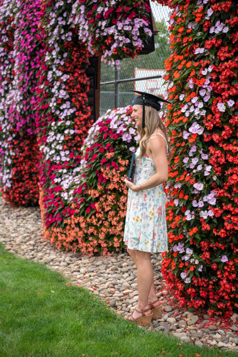 The flowered dress of Lauren R. Ball, a physicain assistant alumna from Danville, accents the picture-perfect botanical feature near the campus tennis courts. Ball was this year's recipient of the Russell M. Trapp Professionalism Award, which honors a former PA program director who died in March 1998.