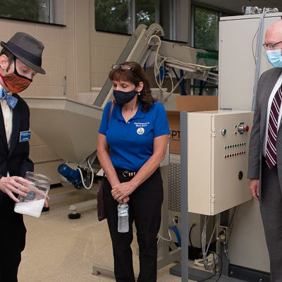 Bradley M. Webb (left), dean of engineering technologies, discusses plastic pellets during a lab tour with Rep. Barbara Gleim (R-199) and Rep. Martin Causer (R-67), committee chair.