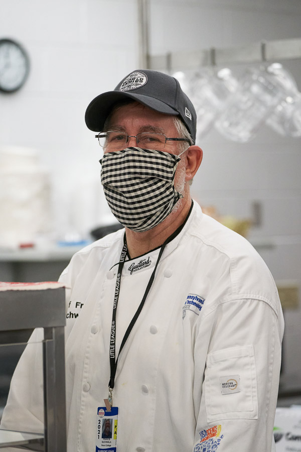 Chef Frank M. Suchwala, associate professor of hospitality management/culinary arts, is among a team of about a dozen making the short trip to the World Series to serve the teams. Back on campus, every class and kitchen in the hospitality program is involved in preparing the meals.