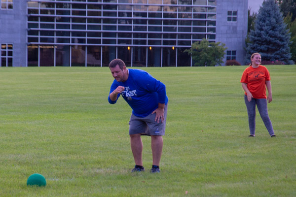 It's all in the wrist for Jeremy R. Bottorf, coordinator of campus recreation – and one heck of a pitcher – as he sends another one toward the kicker.