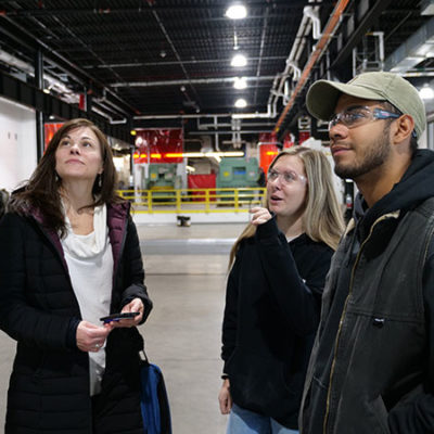 Passante (left) talks with students during a visit to campus in early 2020. At right are Sara D. Stafford, of West Chester, who earned a welding technology degree in May 2020 and is working toward her bachelor's in applied management, and Axel A. Murillo, a welding and fabrication engineering technology major from Watsontown.