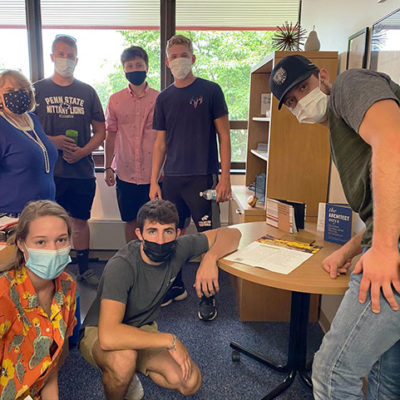 Properly masked and artfully composed, students connect with another new arrival (and unfailingly good sport) Ellyn A. Lester, assistant dean of construction and architectural technologies.
