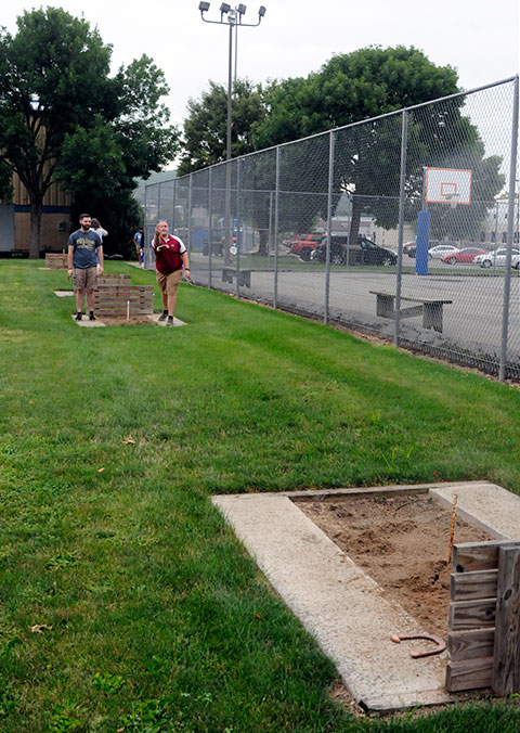 Engineering design technology majors Wesley S. McCray (left), of Corry, and Daniel T. Wright, of Middleburg, warm up at the horseshoe pits south of the Field House ... 