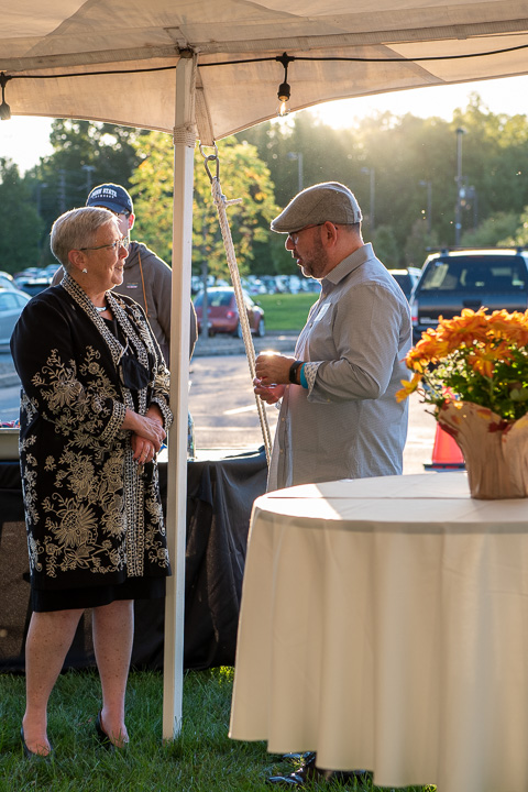 In the glow of an early autumn evening, the president enjoys conversation with Colletti, who traveled back to campus from Little Elm, Texas, a small town north of Dallas, where he has enjoyed a postgraduate career with Toyota Motor Sales USA Inc.