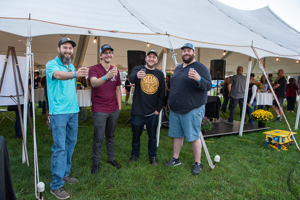 Regulars on the Tent Party scene are these graduates of the first class of brewing & fermentation science major (from left): Ryan J. Hampton, William B. Ernst-Wingfield, Luke H. Brown and Christopher P. Good, all enjoying careers as brewers. 