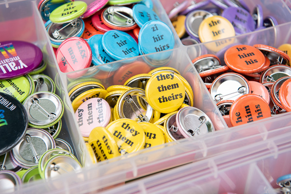 Pronoun pins and pride flags are also part of the multicultural gathering.