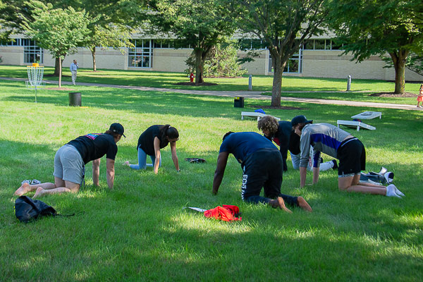 A 15-minute yoga session stresses mindfulness and de-stresses participants.