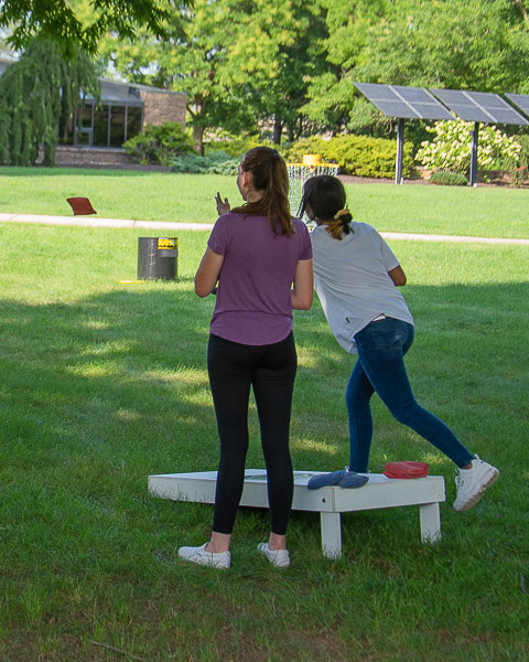 A spacious campus lawn provides ample room to enjoy cornhole, Spikeball and Frisbee. 