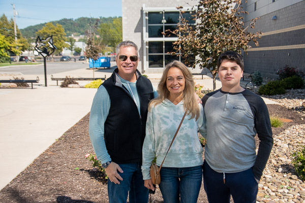 Mike, Karen and Mike Shupp traverse campus under sunny skies. The younger Mike, of Pocono Pines, is pursuing a degree in business administration.